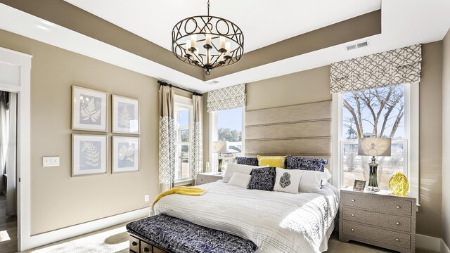 bedroom with a notable chandelier