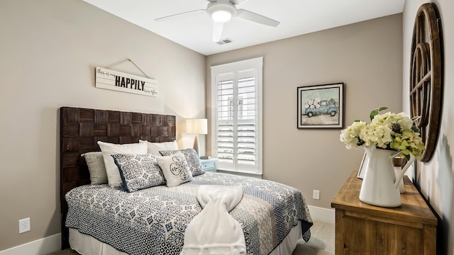 bedroom with multiple windows, carpet flooring, and ceiling fan