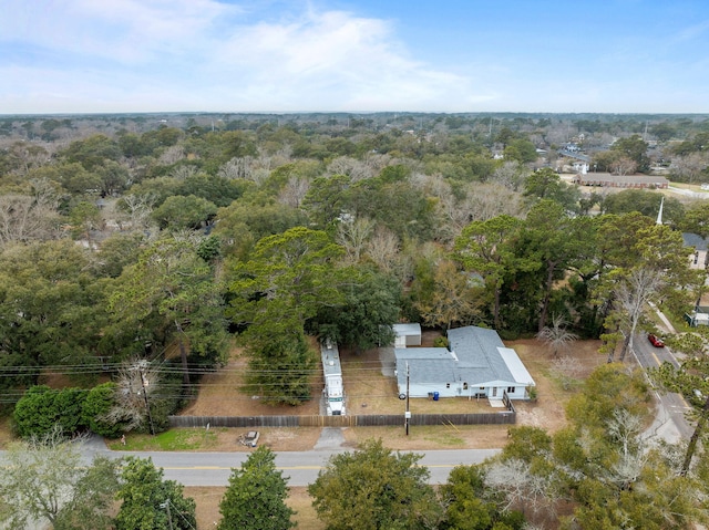 birds eye view of property with a wooded view