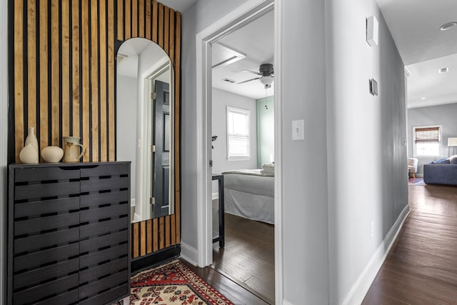 corridor featuring dark hardwood / wood-style floors