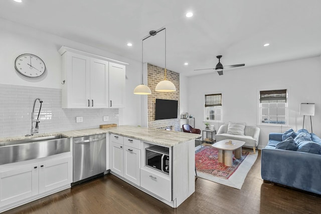 kitchen featuring white cabinets, sink, kitchen peninsula, and dishwasher