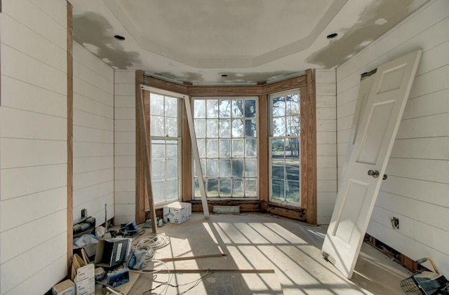 interior space featuring a raised ceiling