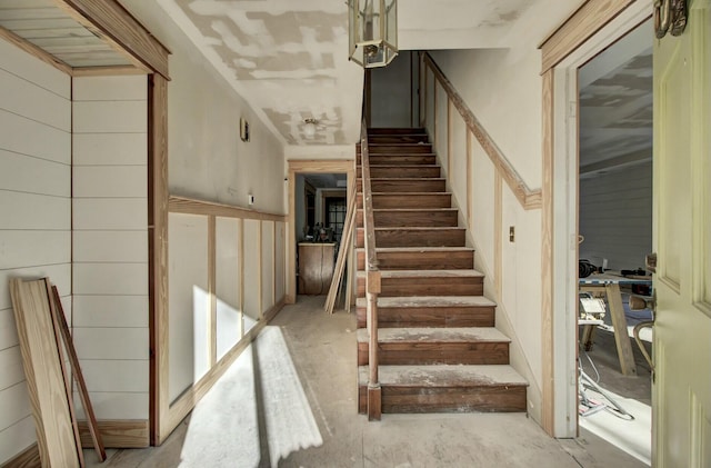 staircase with concrete floors