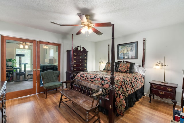 3347 Walter Dr, Johns Island, SC 29455 - bedroom featuring wood finished floors, a textured ceiling, and ceiling fan