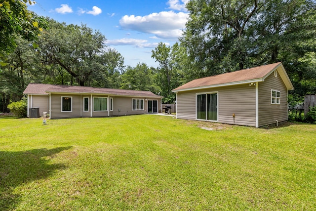 3347 Walter Dr, Johns Island, SC 29455 - back of house with a lawn and view of wooded area