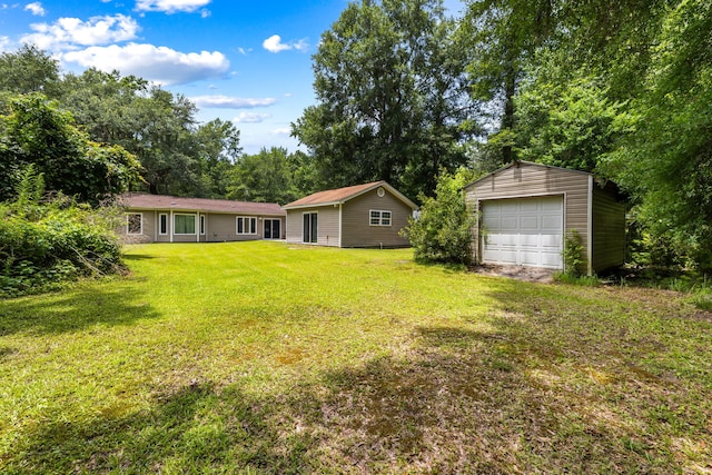 3347 Walter Dr, Johns Island, SC 29455 - view of green lawn with a garage and an outbuilding