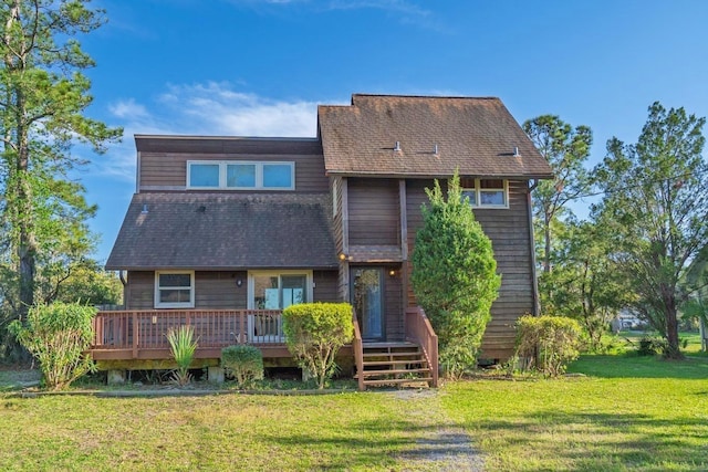 7897 Russell Creek Dr, Edisto Island, SC 29438 - back of house featuring a deck, a lawn, and roof with shingles