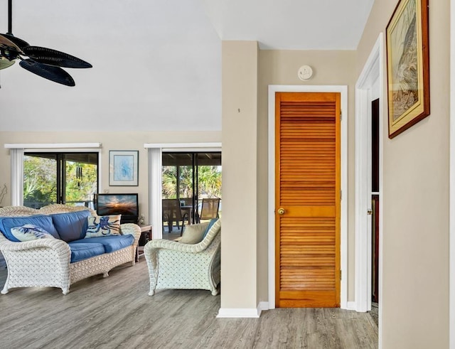 7897 Russell Creek Dr, Edisto Island, SC 29438 - living area featuring wood finished floors, a ceiling fan, and plenty of natural light