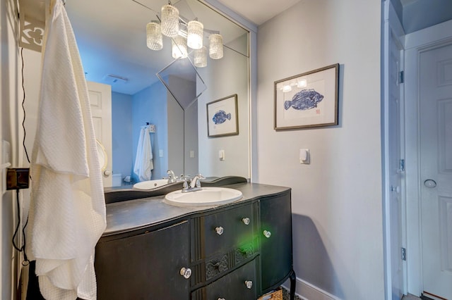 bathroom featuring vanity and baseboards