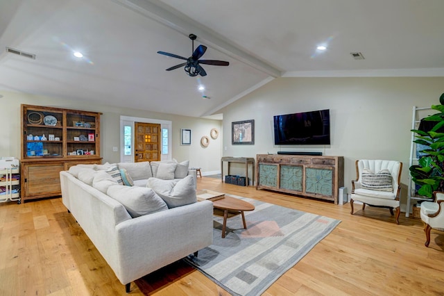 living area with vaulted ceiling with beams, light wood-type flooring, visible vents, and a ceiling fan