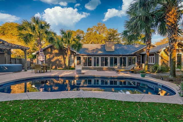 view of swimming pool with a patio, fence, a lawn, a fenced in pool, and a pergola