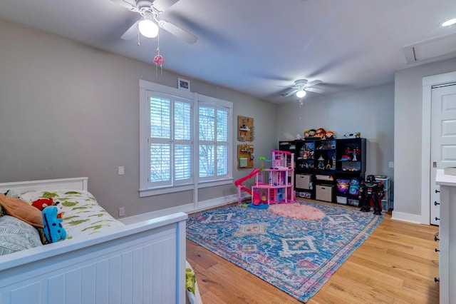 bedroom with light wood-style flooring and ceiling fan