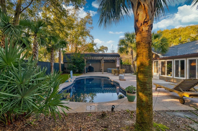 view of pool featuring a fenced in pool, a patio area, a fenced backyard, and a pergola