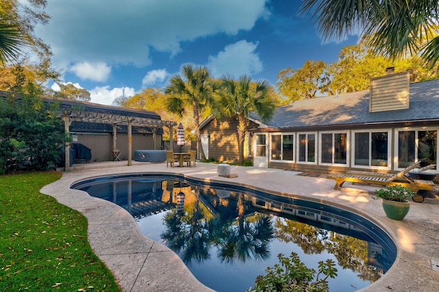 pool featuring a lawn, a patio area, and a pergola