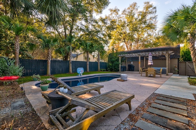 view of pool featuring a fenced backyard, a fenced in pool, a pergola, and a patio