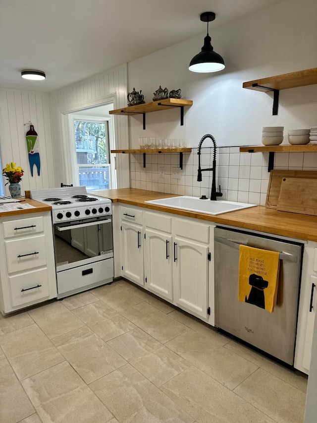 kitchen with backsplash, stainless steel dishwasher, white range oven, white cabinets, and hanging light fixtures