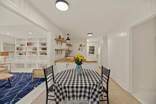 dining space featuring built in shelves