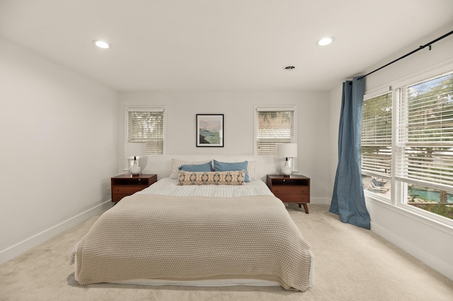 bedroom featuring light colored carpet