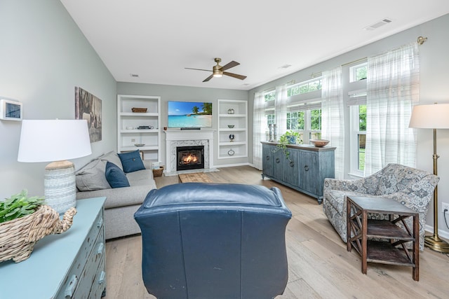 468 Maple Oak Ln, Charleston, SC 29414 - living room with a ceiling fan, light wood finished floors, a fireplace, and built in shelves