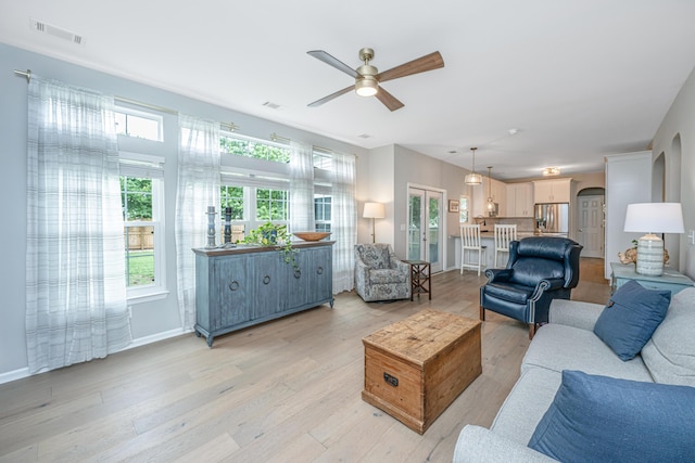 468 Maple Oak Ln, Charleston, SC 29414 - living room featuring a ceiling fan, light wood-style flooring, and arched walkways