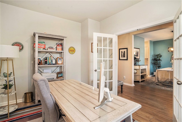 home office featuring wood finished floors and baseboards