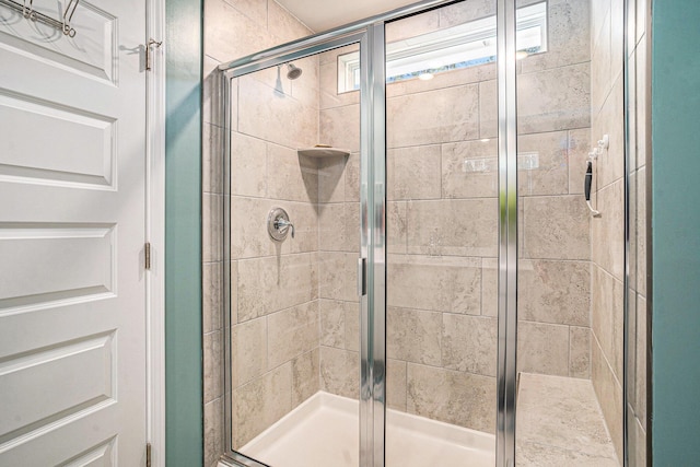 full bath featuring a shower stall