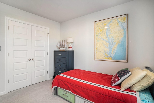 carpeted bedroom featuring a closet