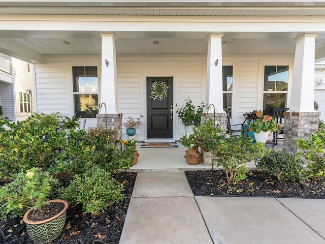 entrance to property with a porch