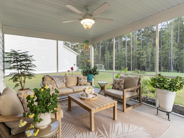 sunroom with a ceiling fan