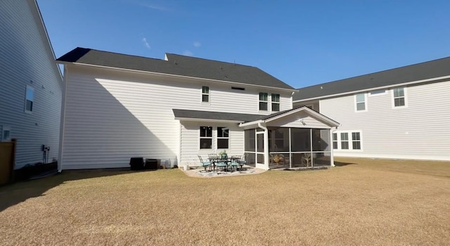 back of property with a patio and a sunroom