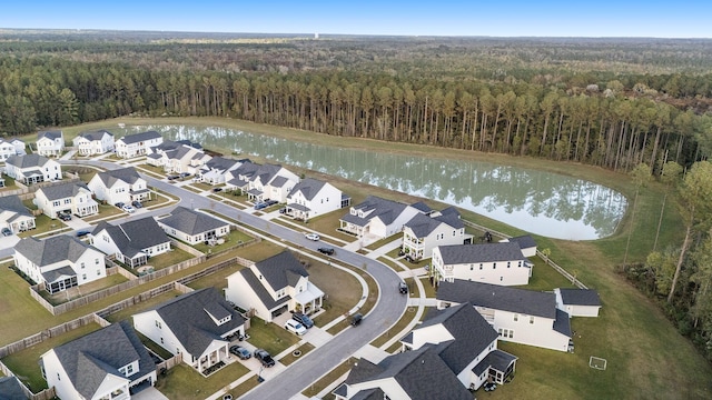 bird's eye view with a residential view, a wooded view, and a water view