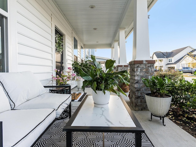 view of patio with an outdoor living space and covered porch