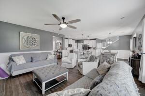 living room with wood finished floors and ceiling fan