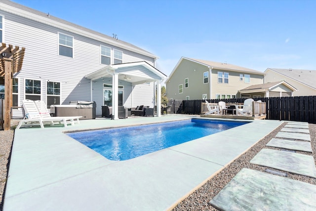 view of swimming pool featuring a patio area, a fenced in pool, and fence