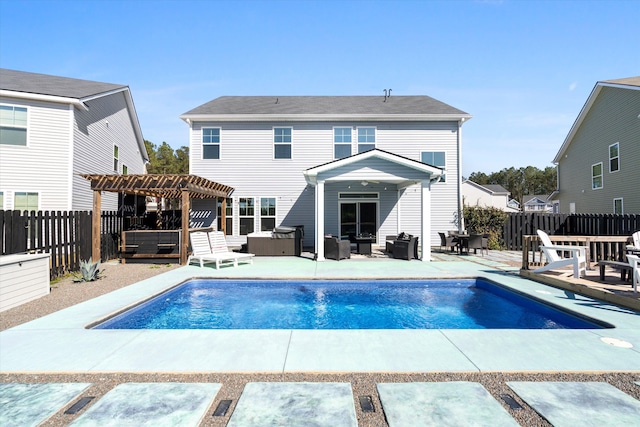 back of property with a patio, a fenced in pool, an outdoor living space, a fenced backyard, and a pergola