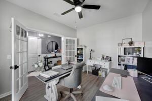 office area with a ceiling fan, wood finished floors, and french doors