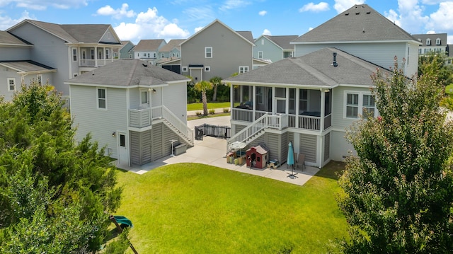 1722 Trewin Ct, Charleston, SC 29492 - back of house featuring a sunroom, a patio, stairway, a residential view, and roof with shingles