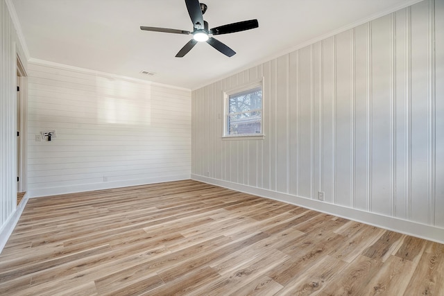 unfurnished room featuring crown molding, ceiling fan, and light wood-type flooring