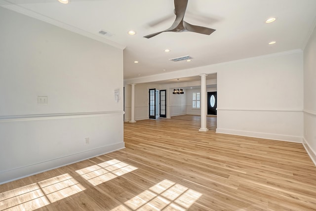 interior space featuring ornate columns, crown molding, ceiling fan with notable chandelier, and light hardwood / wood-style floors