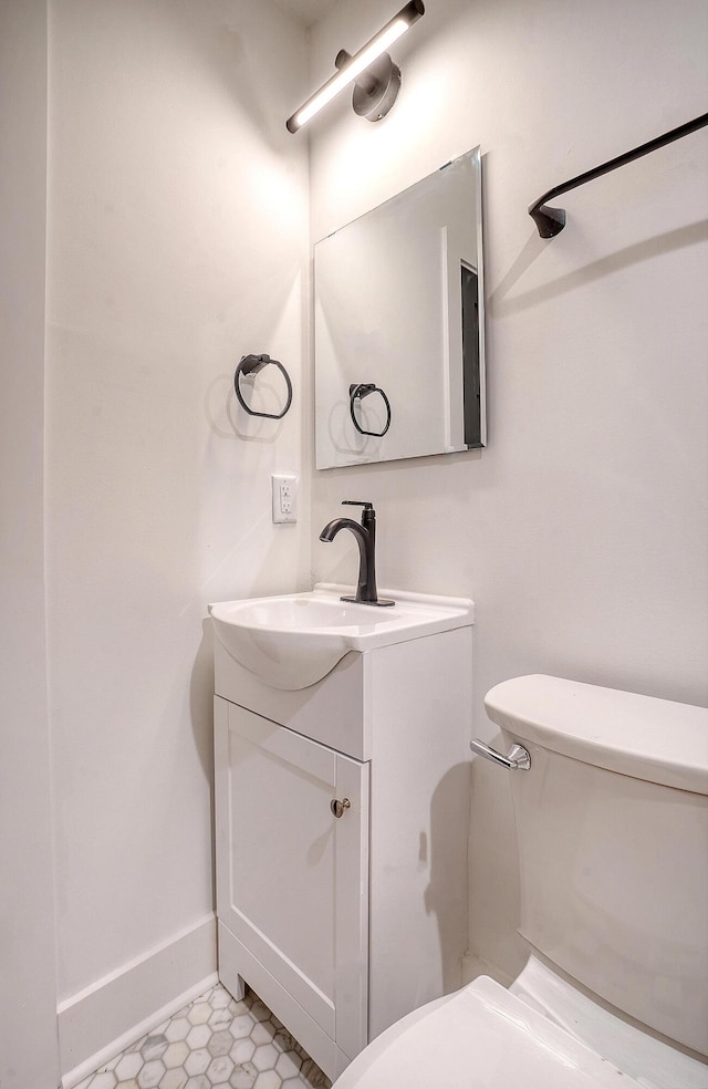 bathroom with vanity and toilet