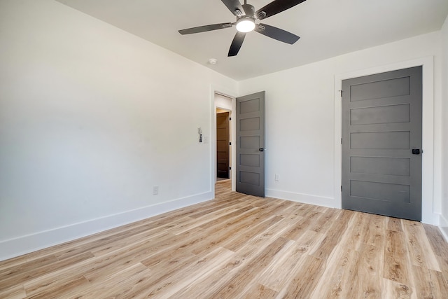 spare room with ceiling fan and light hardwood / wood-style flooring