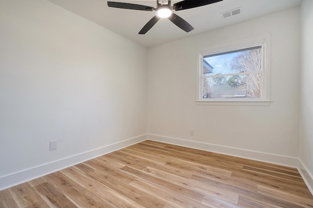 spare room with ceiling fan and light hardwood / wood-style floors