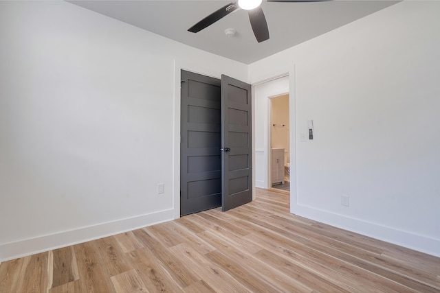 unfurnished bedroom featuring ceiling fan and light hardwood / wood-style flooring