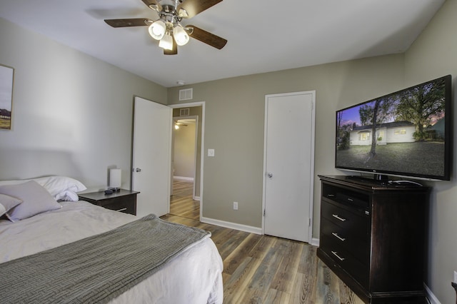 bedroom with dark wood-type flooring and ceiling fan