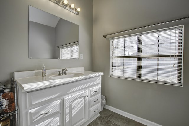 bathroom featuring vanity, tile patterned flooring, and plenty of natural light