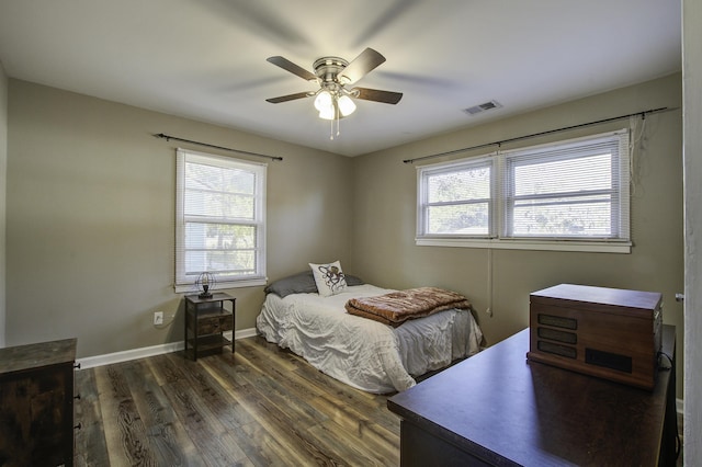 bedroom featuring ceiling fan and dark hardwood / wood-style flooring