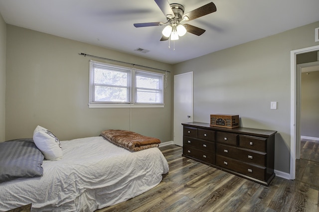 bedroom featuring ceiling fan and dark hardwood / wood-style flooring