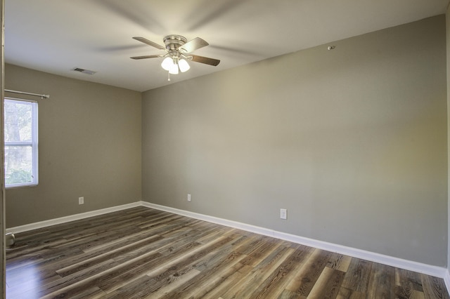 unfurnished room featuring ceiling fan and dark hardwood / wood-style flooring