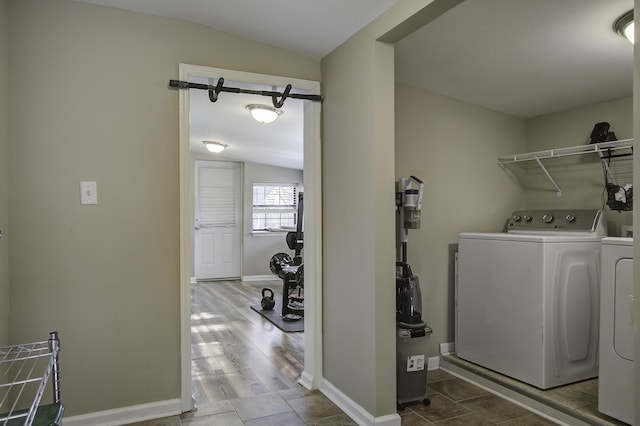 clothes washing area with washer and clothes dryer