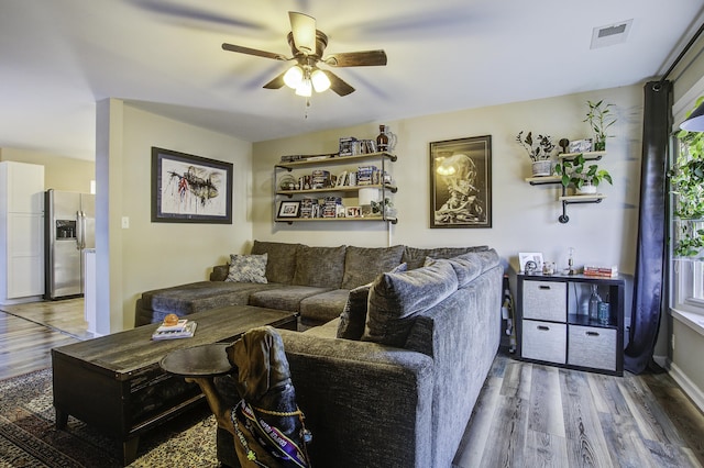 living room with ceiling fan and hardwood / wood-style floors